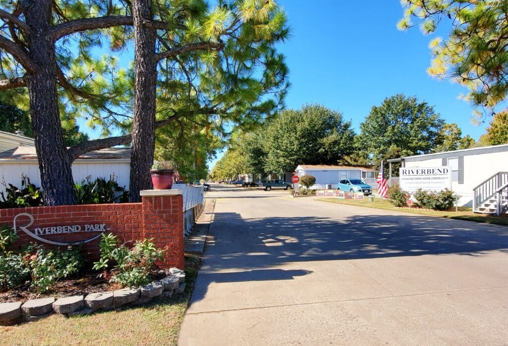 Entrance to mobile home community with trees